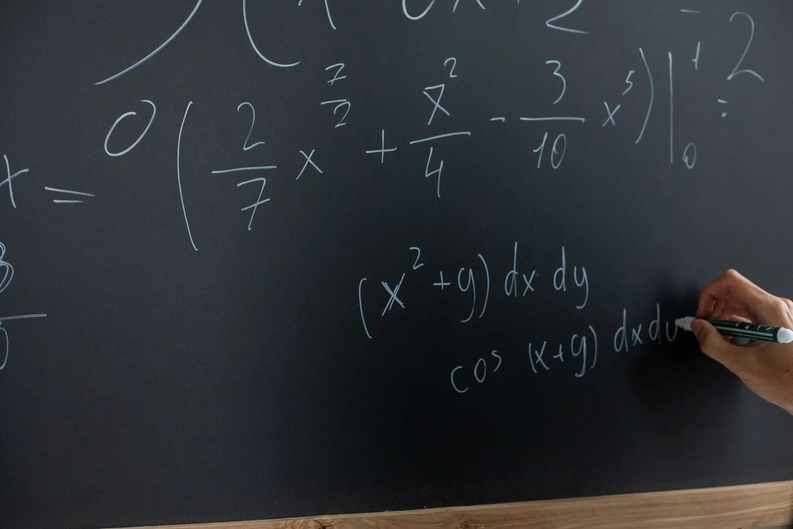 Qualified AP Calculus BC tutors - instructor working through integral calculus on a chalkboard