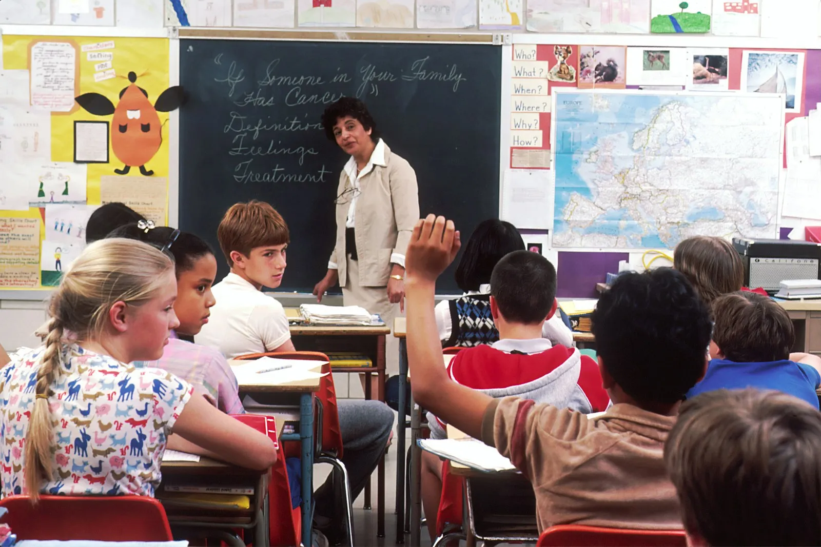 Qualified Creative Reading tutors - instructor guiding students through an engaging classroom lesson