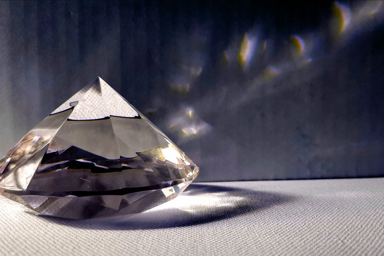 What is Physics - light refracting through a faceted crystal to reveal the visible spectrum